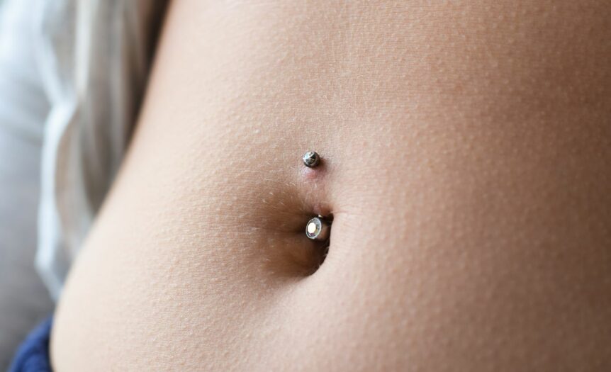 how long does it take for a belly button piercing to heal before swimming